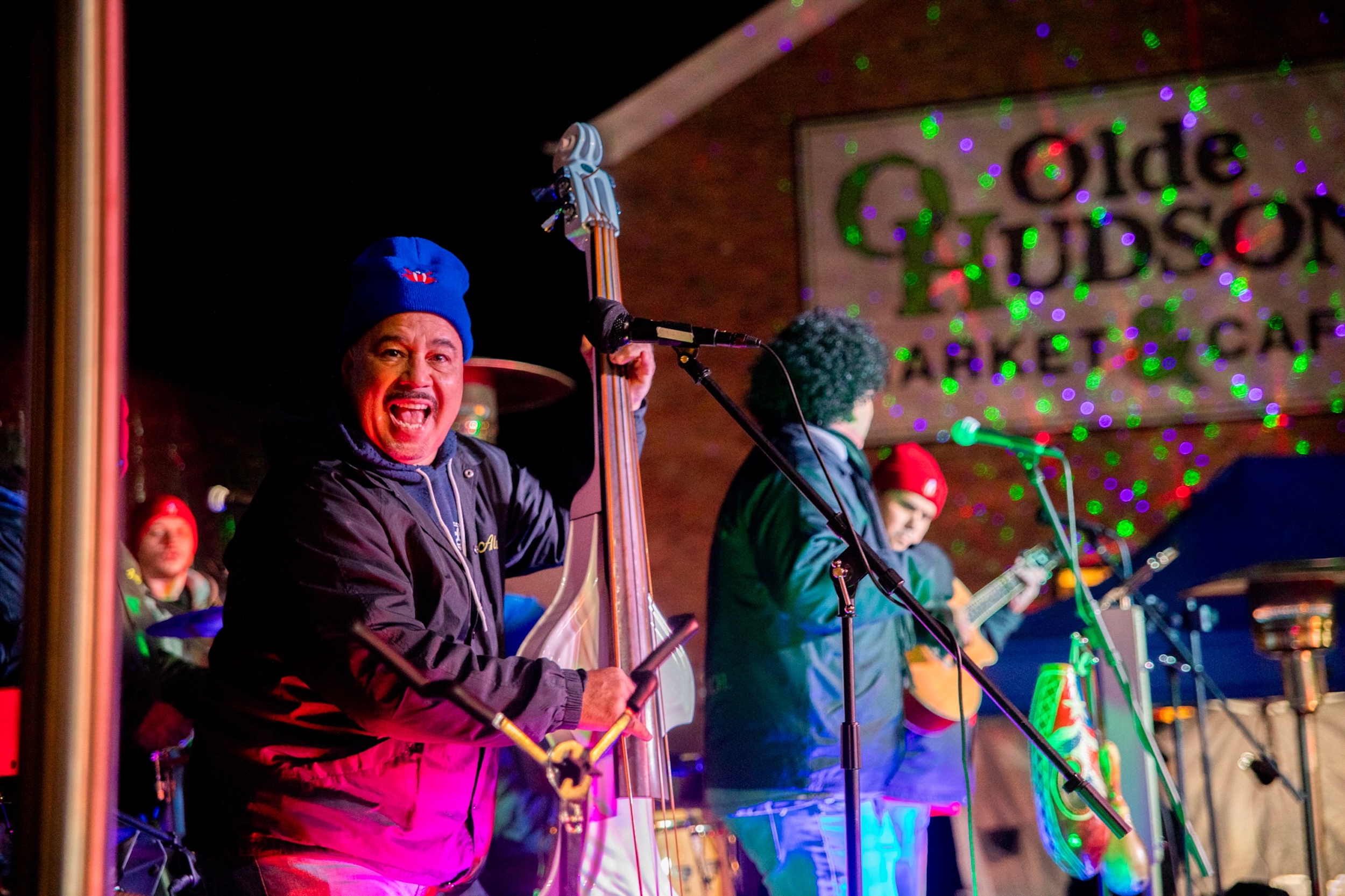 Band playing outdoors at night.
